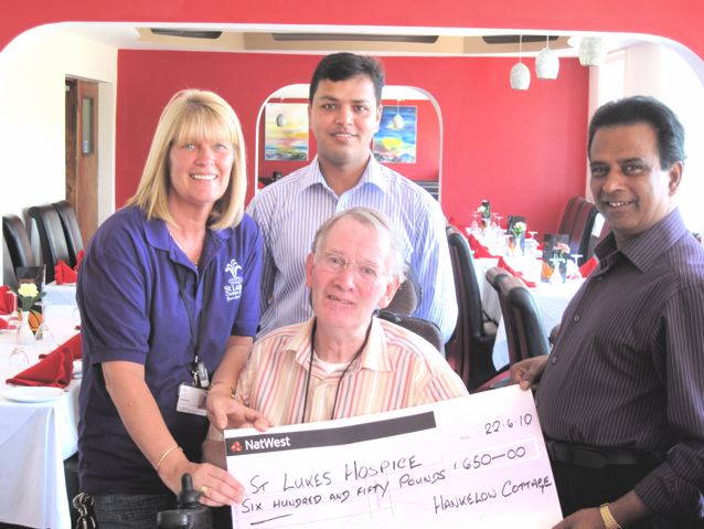 The proprietors of Hankelow Cottage Bangladeshi Indian restaurant donate &pound;650 to St. Lukes Cheshire Hospice